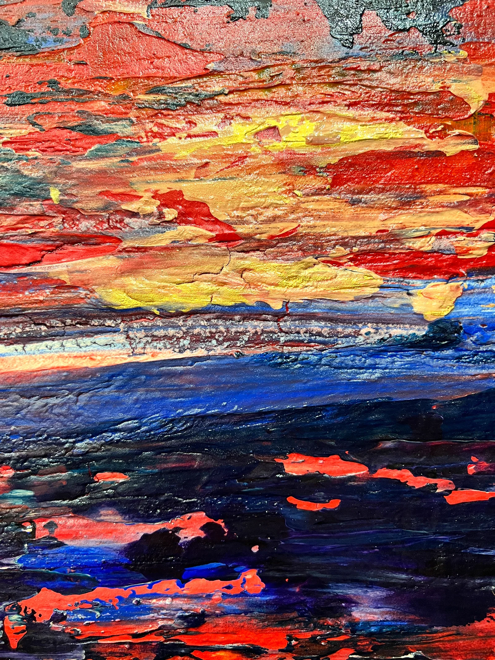 Close-up of the layered red, yellow and blue paint textures in Dawn is Breaking.