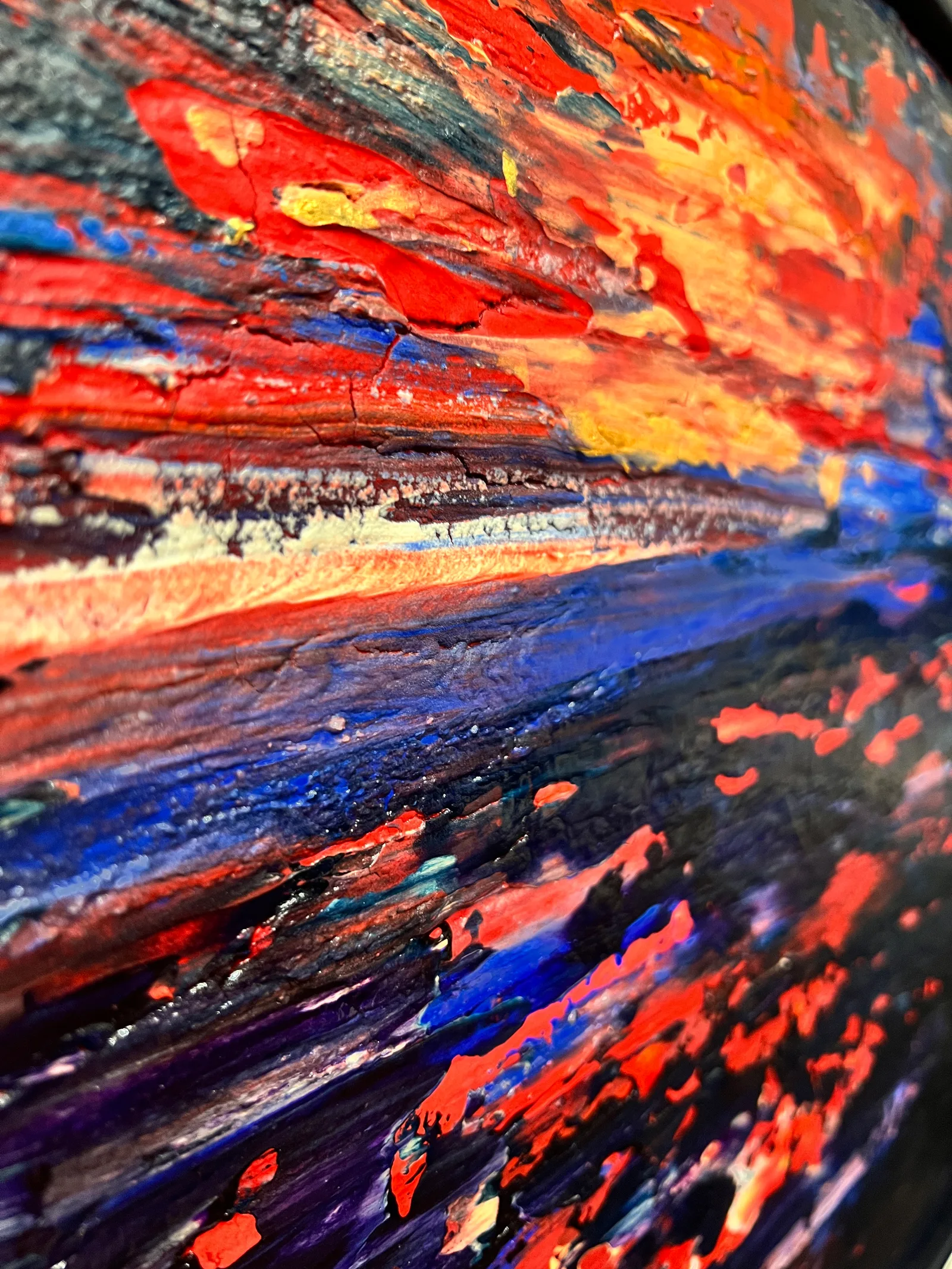 Angled close-up of the raised red, yellow and blue paint textures in Dawn is Breaking.