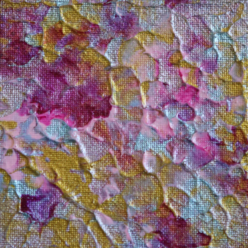 A close-up of textured KNH abstract artwork in pink, burgundy, silver, and gold.