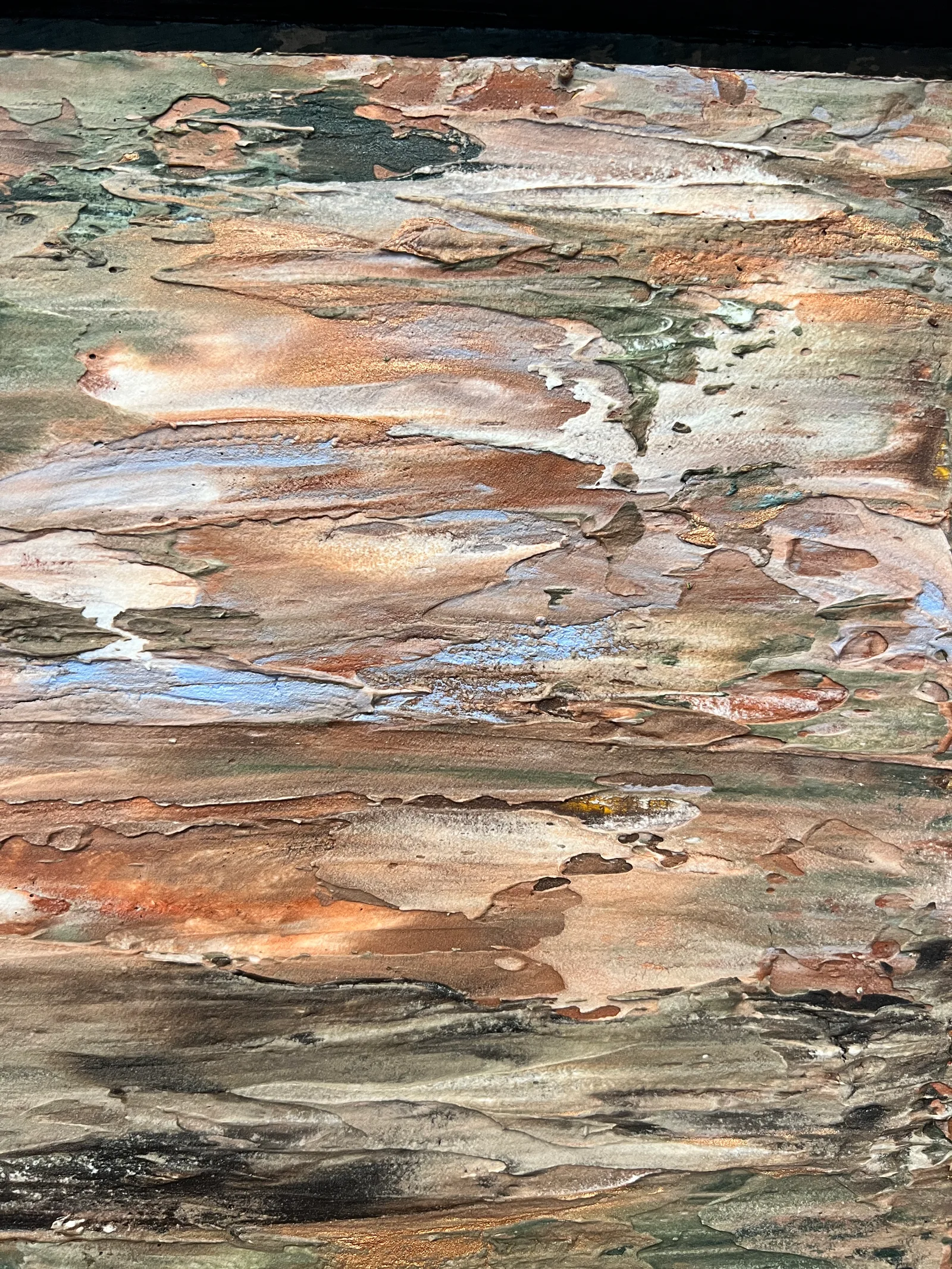 Close-up of the raised paint textures and copper-colored highlights in Georgia Clay.