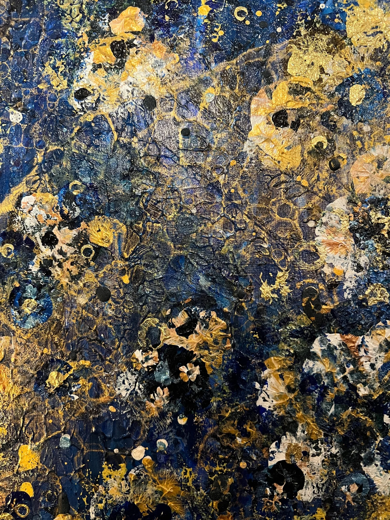 Close-up view of the layered blue, gold, cream, and peach textures in Orion’s Garden.