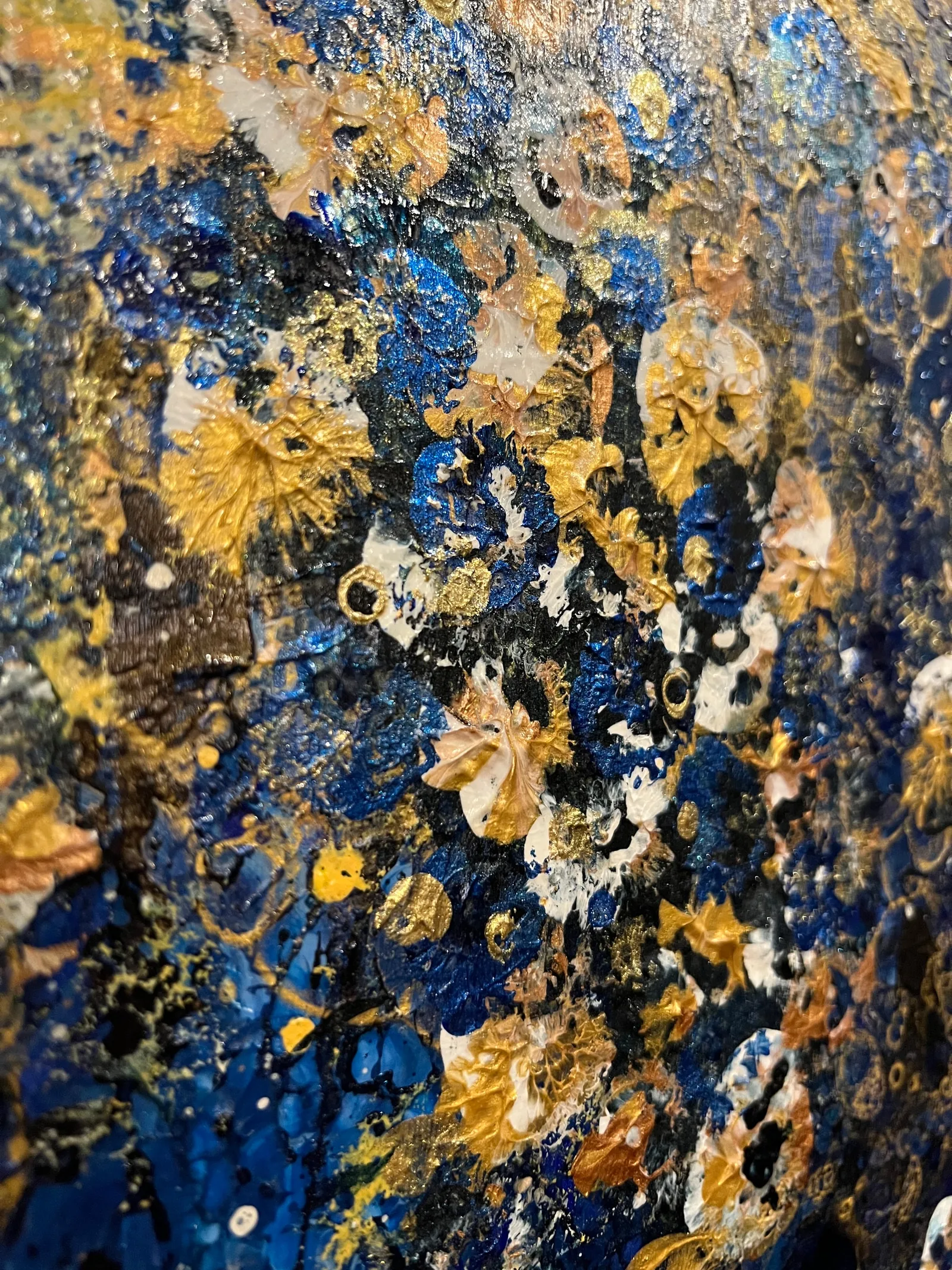 Angled close-up showing the dimensional paint texture and metallic details of Orion’s Garden.