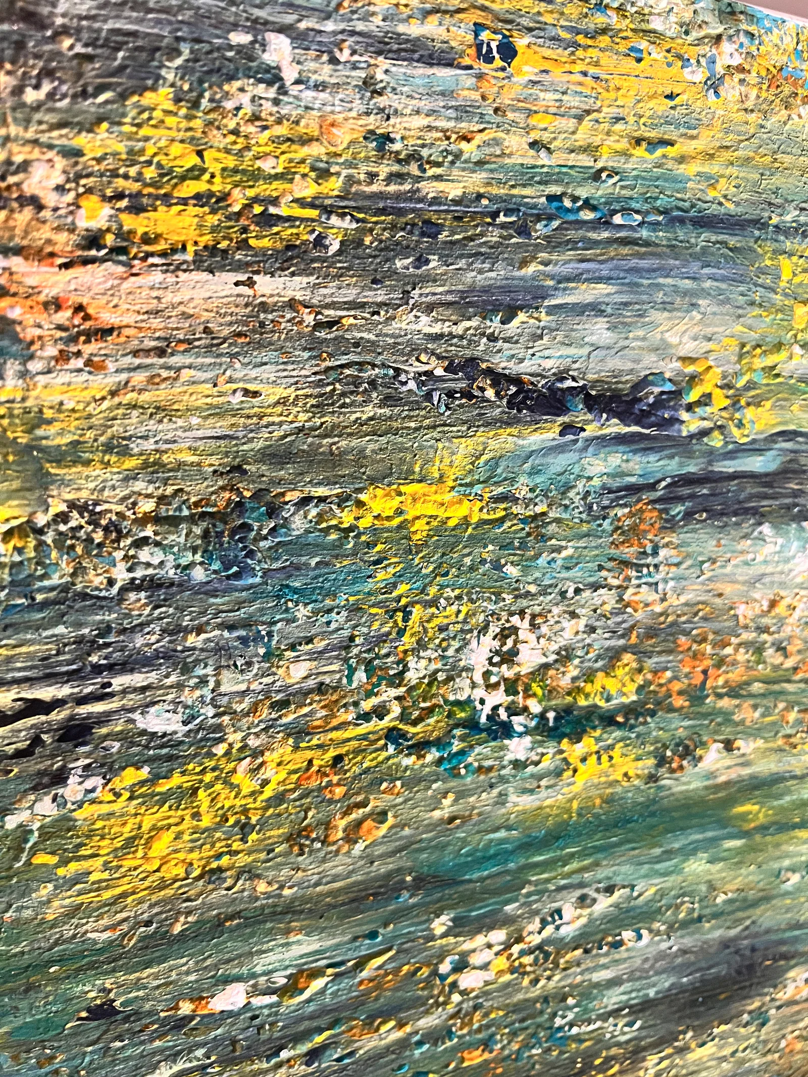 Close-up of the layered green, blue and yellow paint textures in Somewhere Between.